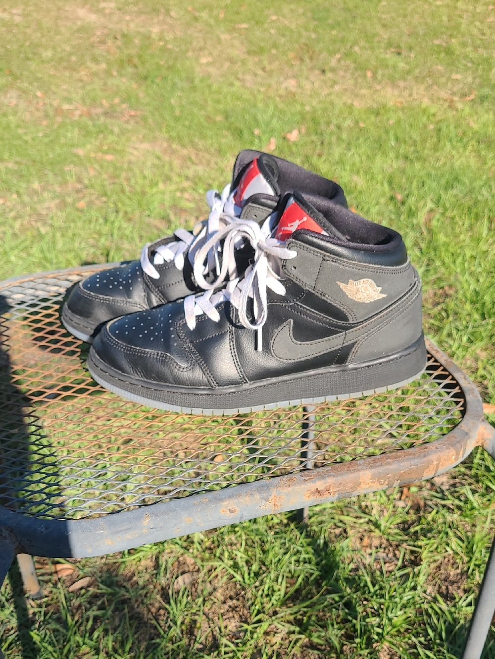 Jordan Kids Black High-Top Sneakers with Red Tongue Accents 7y